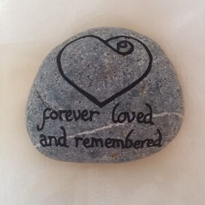 These can be very simple or have more detail if you prefer.  The varnish is for outdoor use, so these should have good longevity for marking a place of importance.  The image is just an indication of the type of stone you may choose to have.  This picture is before being varnished.  You could add a name to the heart or have a totally different style.  
Prices start at £5